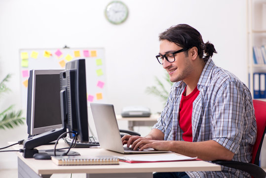 Male It Specialist Working In The Office 