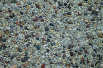 image of pebbles on concrete.