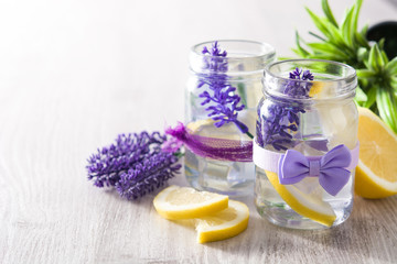 Obraz na płótnie Canvas Lavender lemonade drink in jar on wooden table