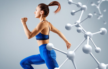 Sporty young woman running and jumping near molecules structure. - 270008899