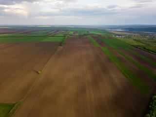 Obraz premium Flight over cultivating field in the spring. Moldova Republic of.