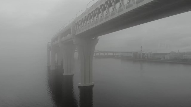 Bridge in the fog. Kanonersky island, St. Petersburg, Russia