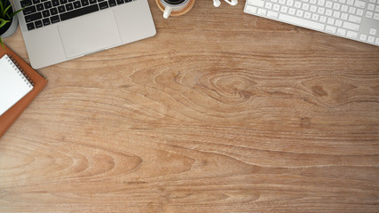 Wood office desk table with laptop computer and copy space
