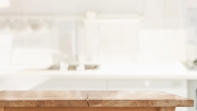 Wood top table in kitchen room background and copy spce for productor food montage