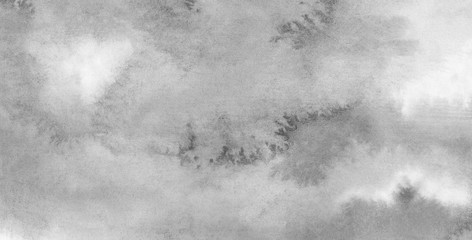 Monochrome smeared gray aquarelle painted paper textured canvas for design, vintage card. Black and white ink effect water color illustration. Abstract grunge grey shades watercolor background