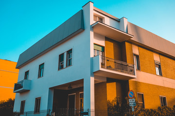 Fototapeta na wymiar modern apartment building with orange and white facade