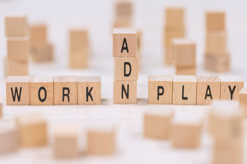 work and play wooden cubes background