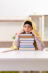 Female student in hijab preparing for exams 