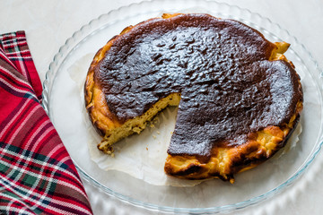 San Sebastian Cheesecake on Wooden surface / Creamy Plain New York Style.