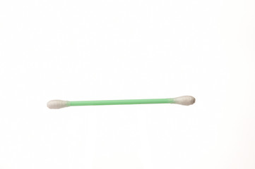 Close-up of cotton swabs on white background