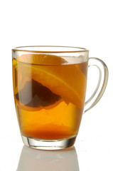 Fresh brewed tea with orange glass mug isolated on white