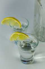 vodka in a glass with lemon