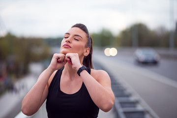 Caucasian woman warming up neck before training