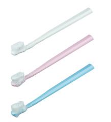 Set of three toothbrushes with foam from paste of different colors isolated on white background.