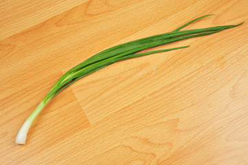 Fresh garden herbs. Spring onion. Isolated on wooden background