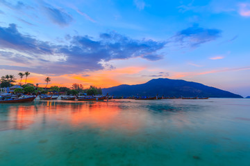 Beautiful sunset on white sand beach and Clear water to see the coral reef at Koh Lipe island in Satun,Thailand