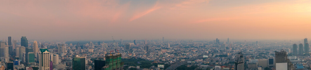 Long horizontal panorama cityscape of Bangkok at sunset. Thailand