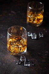 Glasses of whiskey with ice