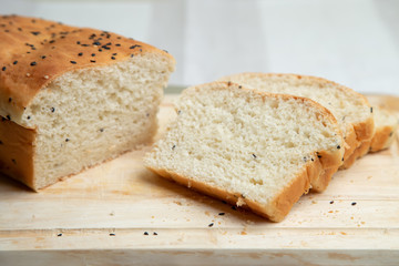 Homemade white bread with sesame. Selective focus, close-up.