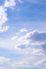 Fototapeta premium White clouds high in the sky at windy winter day background