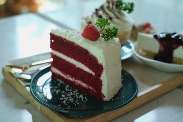 Red Velvet cake in the wooden tray on the table