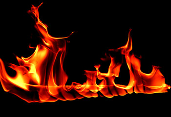 Fototapeta premium Fire flames on Abstract art black background, Burning red hot sparks rise, Fiery orange glowing flying particles