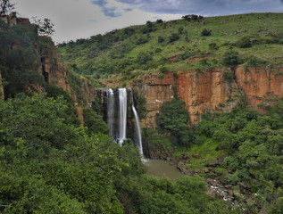 Waterfall in South Africa surrounded by red cliffs