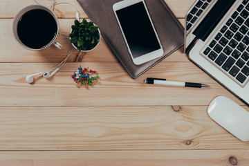 Working space. Laptop, notepad on wooden desk
