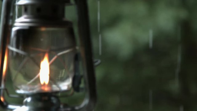Pouring rain and old oli lantern