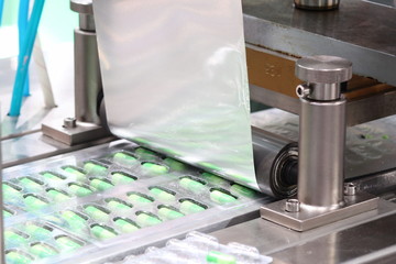 medicine capsules packing machine ;  production process ;health industry background