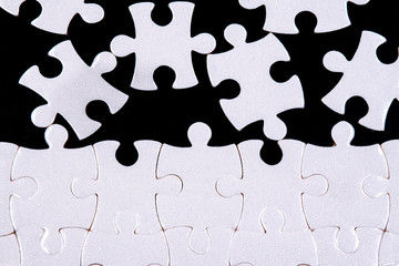 White jigsaw puzzle with black background