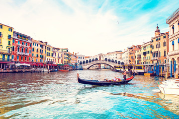 Fototapeta premium magical landscape with gondola on the Grand Canal in Venice, Italy. popular tourist attraction. Wonderful exciting places. (vacation, rest - concept)