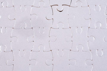 White jigsaw puzzle with black background
