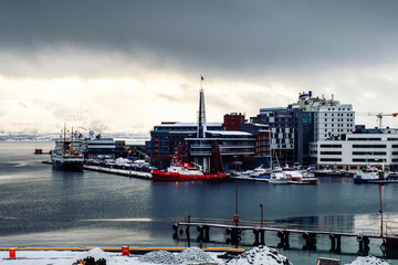 Cloudy day in famous north town Tromso, Norway. View of the fjord