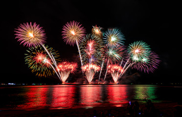 celebrations firework at night on the sea pattaya city Thailand