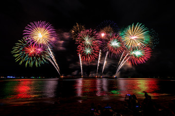 celebrations firework at night on the sea pattaya city Thailand