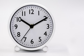 White alarm clock isolated in white background