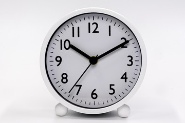 White alarm clock isolated in white background