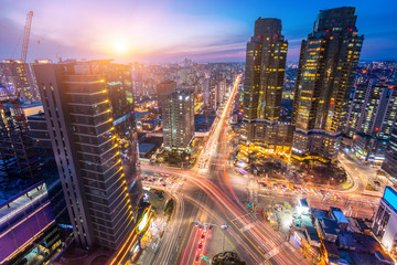 Seoul city and Traffic at niaht intersection in downtown Seoul, South Korea