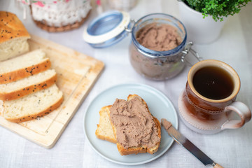 Homemade chicken liver pate, homemade white bread. Breakfast. Selective focus, close-up.