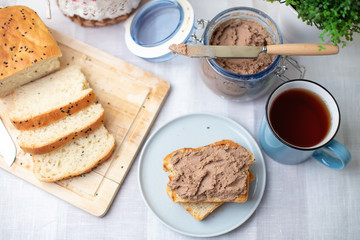 Homemade chicken liver pate, homemade white bread. Breakfast. Selective focus, close-up.