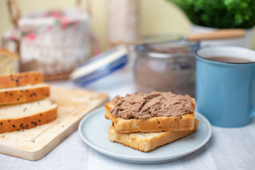 Homemade chicken liver pate, homemade white bread. Breakfast. Selective focus, close-up.