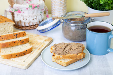 Homemade chicken liver pate, homemade white bread. Breakfast. Selective focus, close-up.
