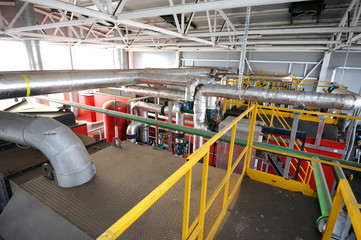 Part of the production hall of the biggest in Ukraine boiler-house using biofuel - wood chip: Complex system of tanks, pipelines, pumps and valves