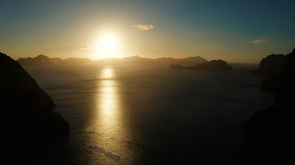Aerial drone seascape with mountains and rocky islands in the morning time El Nido. sunset over the sea. tropical bay in at sunset. Sunset sky and mountains rocks of bay. Dreamy sunset among the rocks