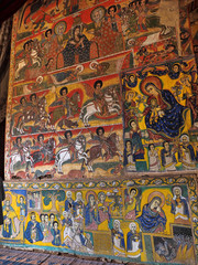 Fototapeta na wymiar Religious frescoes on the walls of the Tana Haik Asus United monastery on Lake Tana in Ethiopia