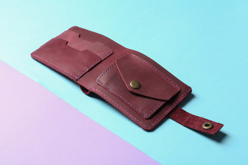 Leather wallet on color background. Stylish accessory