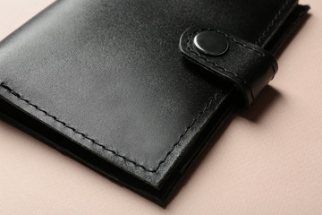Stylish leather wallet on color background, closeup