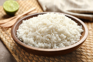 Plate of tasty cooked rice served on table, closeup