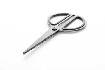 Pair of sharp scissors on white background